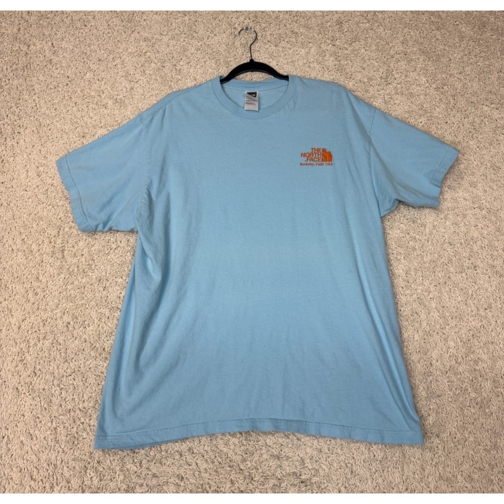The North Face Light Blue Short Sleeve Tee with Orange Logo
